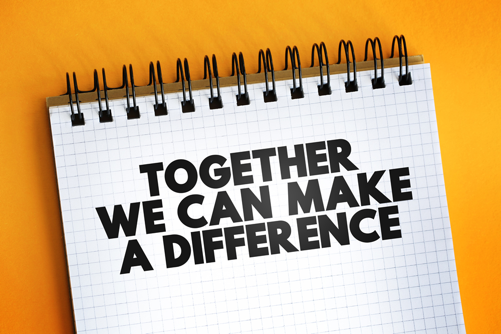 notebook with the message together we can make a difference